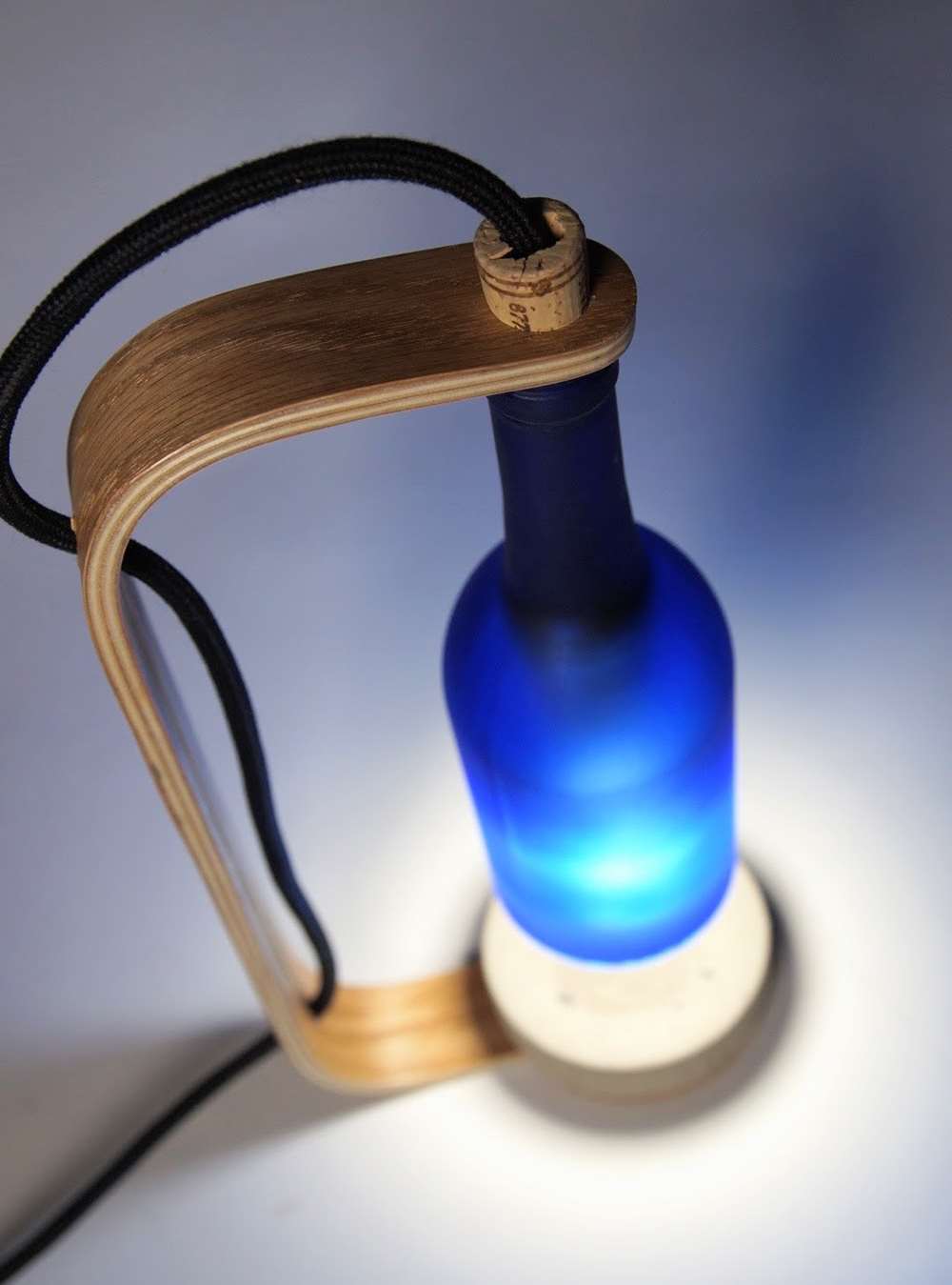 Bent Plywood and Wine Bottle Lamp by Adam Hecht